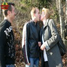 Horny mature slut sucking two guys in the woods